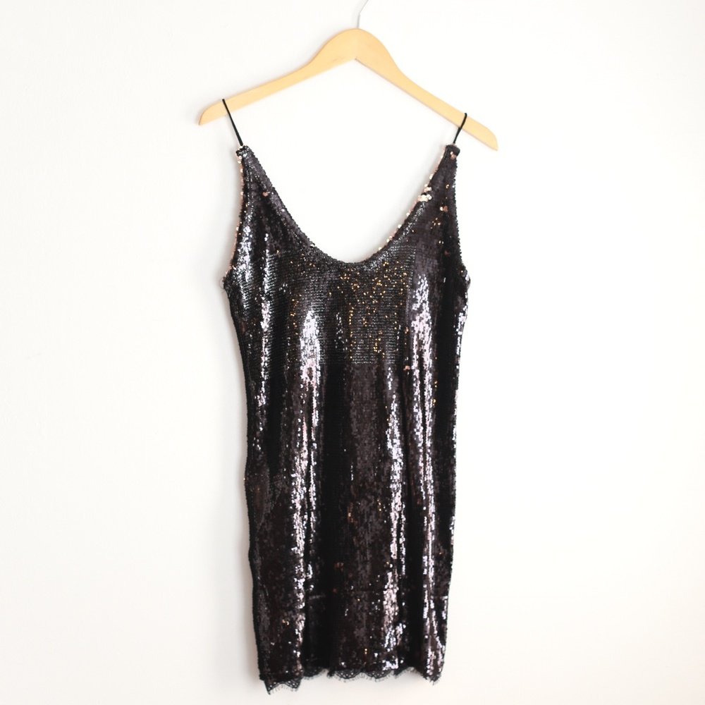 New! Free People black and rose gold top.
